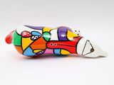 a colorful animal figurine sitting on a white surface