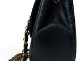 a black purse with a chain hanging from it