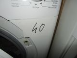 a white washer sitting next to a dryer in a room