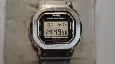 a close up of a watch on display on a cloth