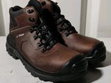 a close up of a pair of brown boots on a table