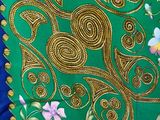 green, blue and gold silk with gold threadwork and floral design