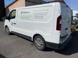 a white van that is parked in a parking lot