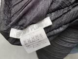 an image of a close up of a black jacket with a label on it