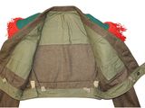 an image of a green jacket with a red pom pom on the back