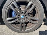 a close up of a tire on a black car