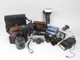 many different types of cameras and cameras on the table