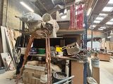 a large room with a ladder and a lot of boxes