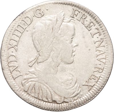 une pièce d'argent portant une tête de femme