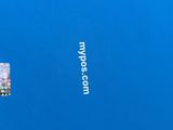 a hand holding a credit card in front of a blue background