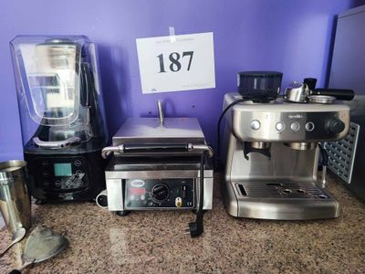 many different types of kitchen appliances on the counter