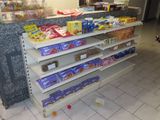 a lot of snacks on the shelves in the store