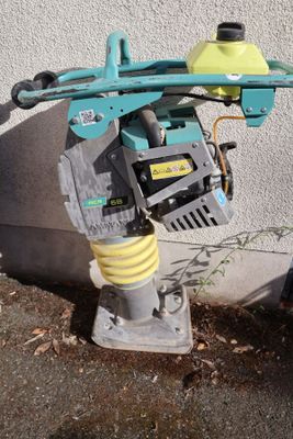 a water hose attached to the side of a fire hydrant