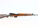 an old rifle with a wooden barrel on a white background