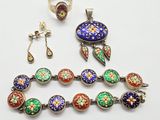 an assortment of jewelry including a bracelet, ring, and earrings