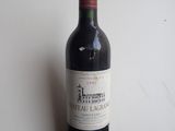 a bottle of wine that is sitting on a table