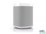 an image of a white and gray speaker sitting on top of a table