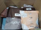 several bags of food are in a cardboard box with labels on them