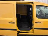 a yellow van with the door open and the driver ' s seat down