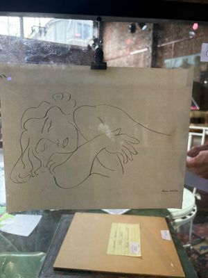 a drawing of a woman holding a child on a piece of paper