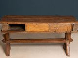 a wooden table with two drawers on top of it