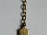 a close up of a keychain with a chain attached to it