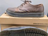 two pairs of shoes are sitting on top of a box