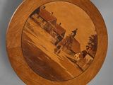 wooden plate with a picture of a church in the center