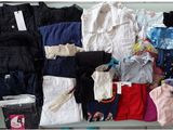 a lot of clothes that are sitting on a table
