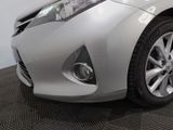 the front end of a silver toyota prius parked in a showroom
