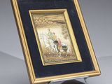 painting of a man riding a horse in a gold frame on a stand