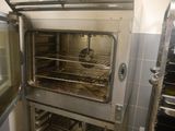 an open oven with a lot of food inside of it