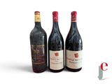 three bottles of wine sitting next to each other on a table