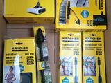 several boxes of cleaning products including a vacuum cleaner and a broom