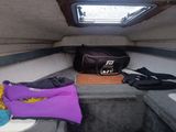 a purple life jacket and a purple life vest on the back of a boat