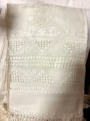 a white table cloth with a design on it