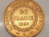 une pièce d'or portant l'inscription « 20 francs »