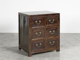 an antique chest of drawers with brass handles and drawers