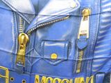 a blue leather jacket with gold zippers and a name on it