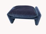 a small blue stool with a cushion on it