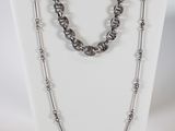 a close up of a necklace on a mannequin display