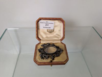 a glass display case with a ring inside of it