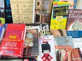 a lot of books that are sitting on a table