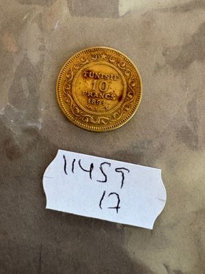 un petit bout de papier sur lequel est représentée une pièce d'or