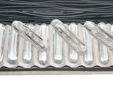 six silver spoons in a silver case on a white surface