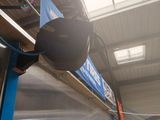 a blurry photo of a subway station with a blue escalator