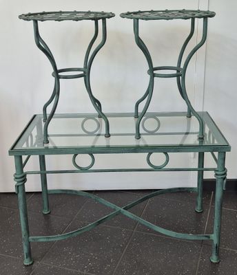 two glass tables that are sitting on a tiled floor