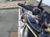 a close up of a motorcycle parked on the side of the road