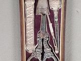 a box that has a pair of scissors and a pair of scissors in it