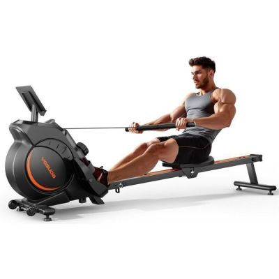 the man is rowing on a rowing machine on a white background